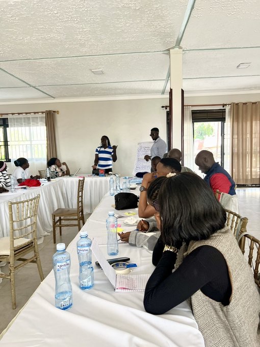 Workshop participants seated at long tables