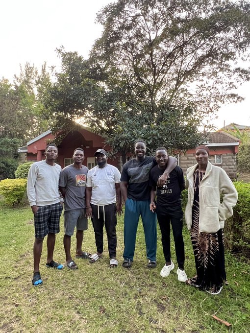 A group gathered outdoors in a garden
