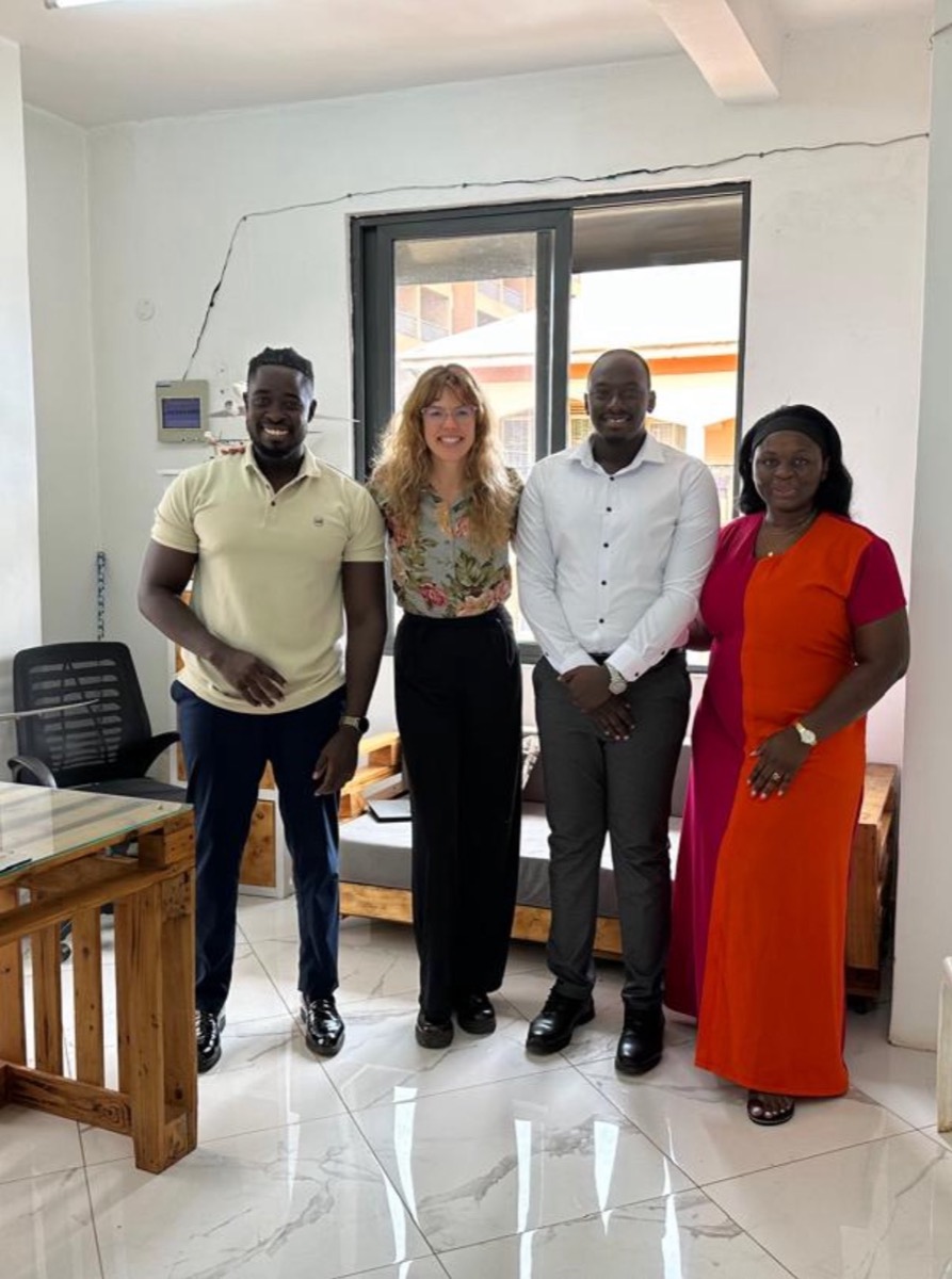Foundation members with two visitors in an office