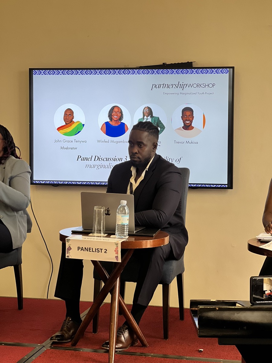 A panelist seated at a panel discussion on partnership
